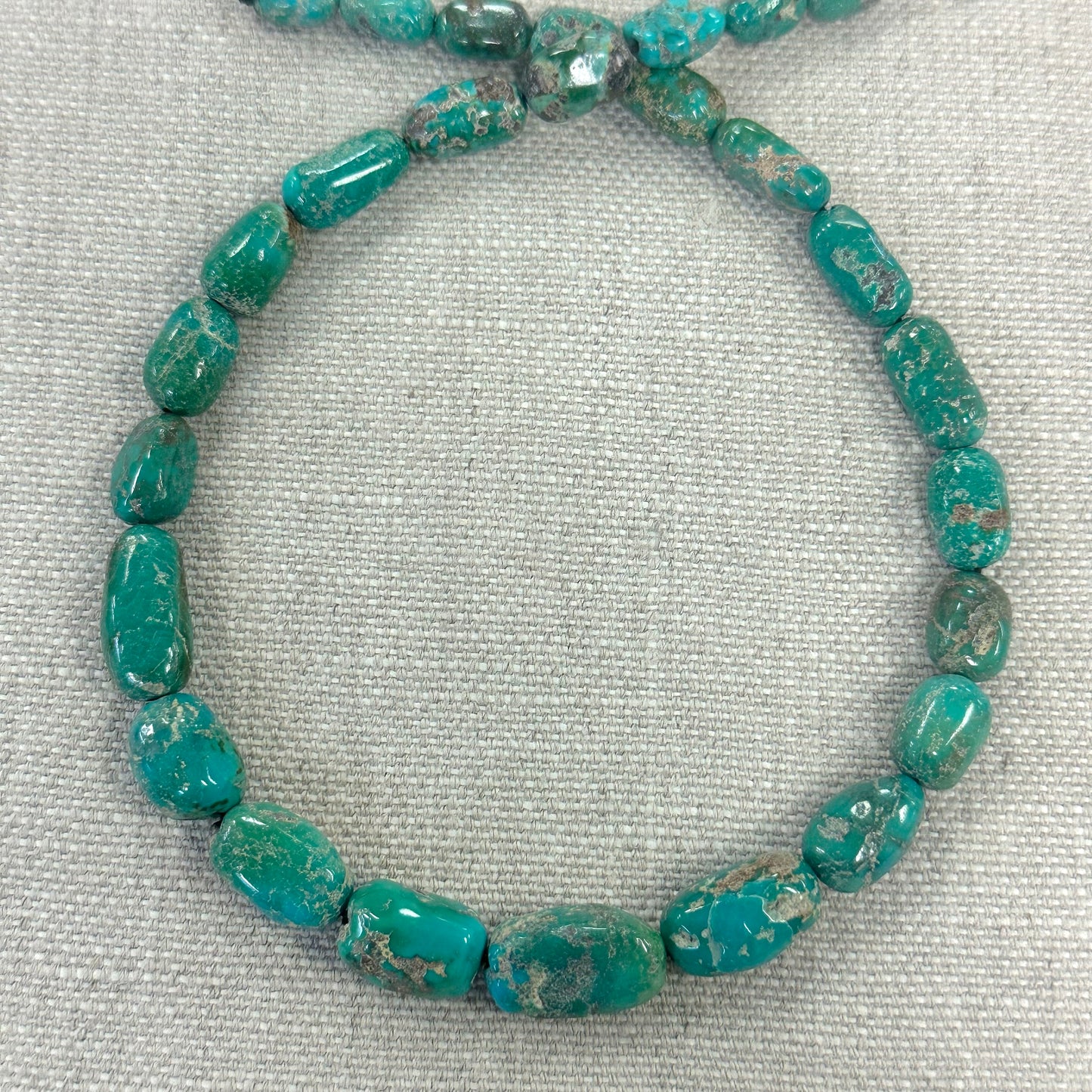 Emerald Valley 7-12.4mm Graduated Barrel Strand  -- 16"