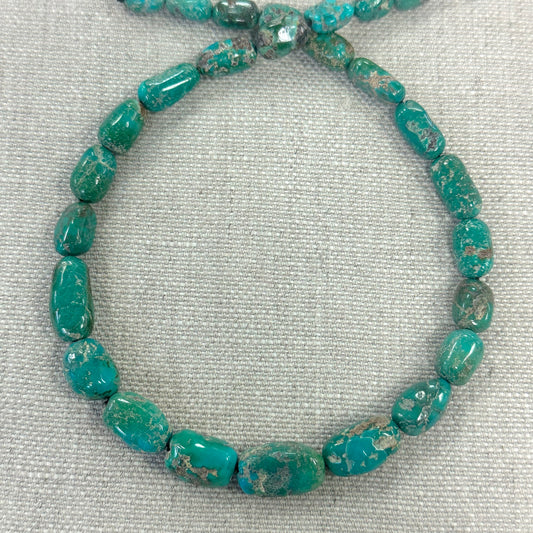 Emerald Valley 7-12.4mm Graduated Barrel Strand  -- 16"
