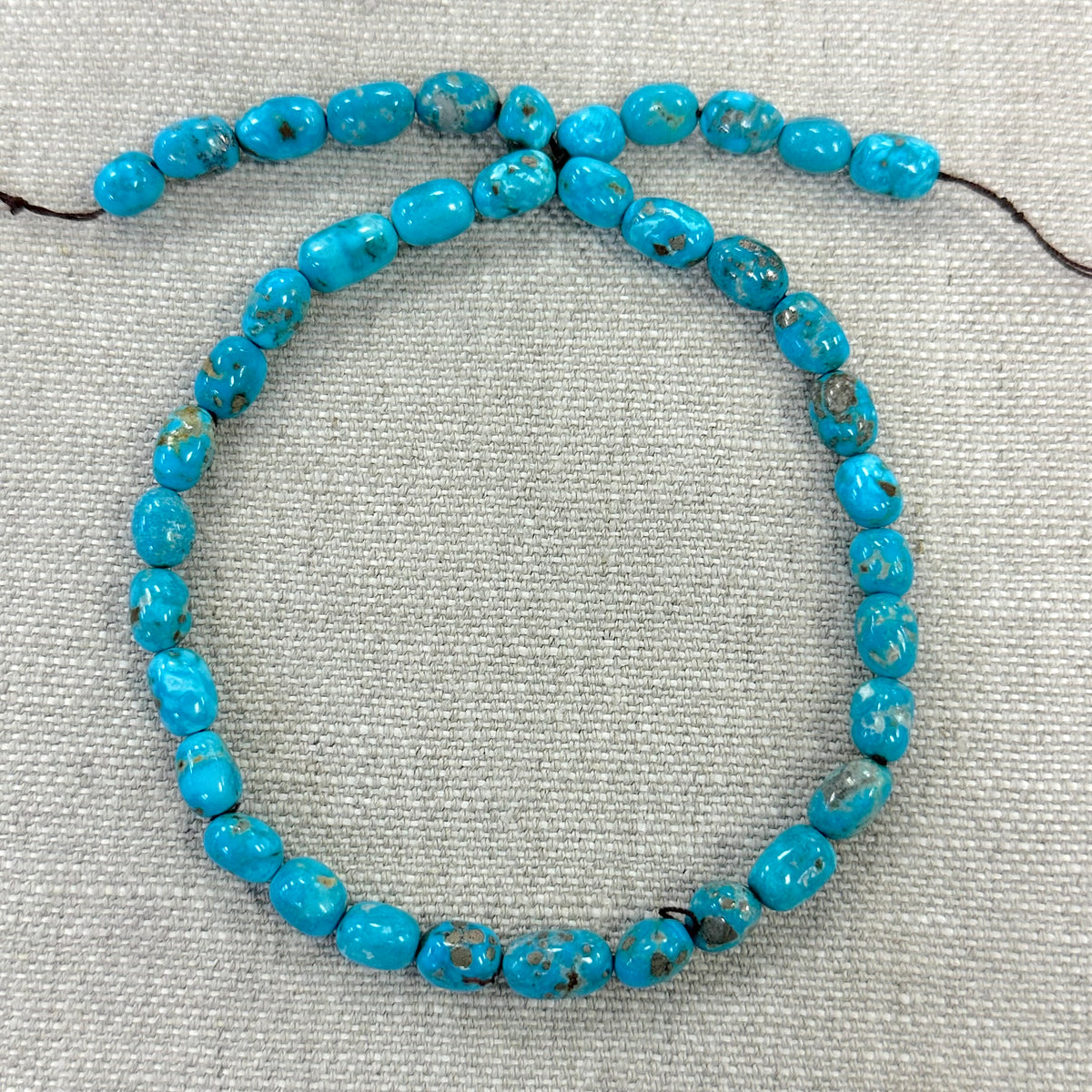 Bluebird 6.9-7.8mm Smooth Nugget Beads -- 16" strand