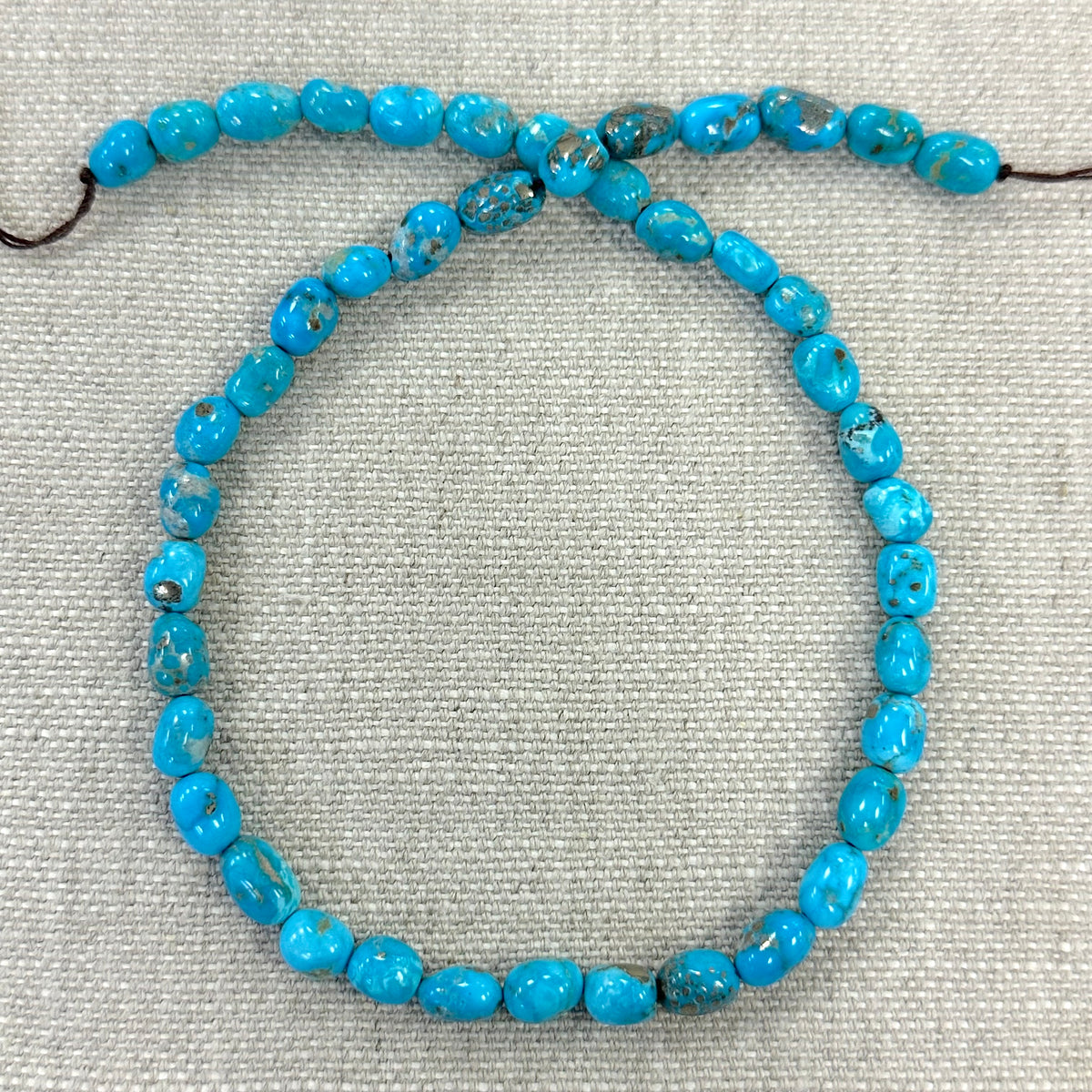 Bluebird 6.7-7mm Smooth Nugget Beads -- 16" strand