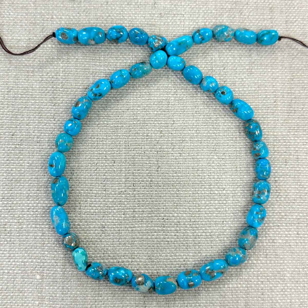 Bluebird 7.4-7.6mm Smooth Nugget Beads -- 16" strand