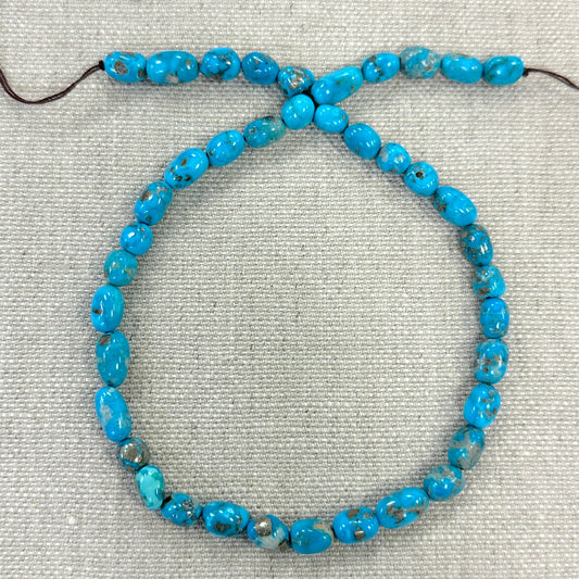 Bluebird 7.4-7.6mm Smooth Nugget Beads -- 16" strand