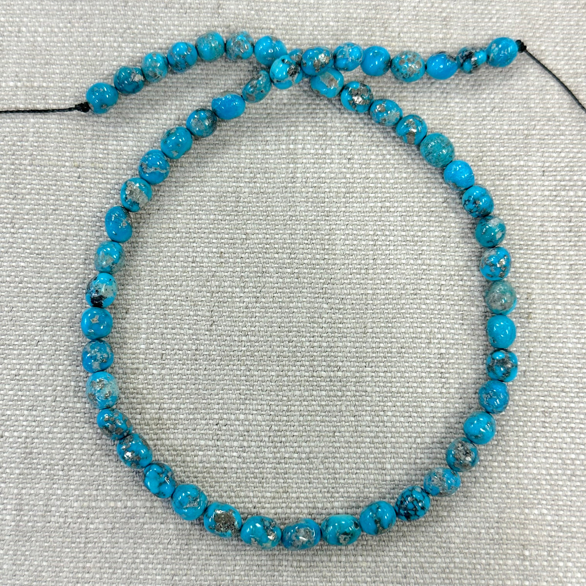 Bluebird 7-7.3mm Smooth Nugget Beads -- 16" strand